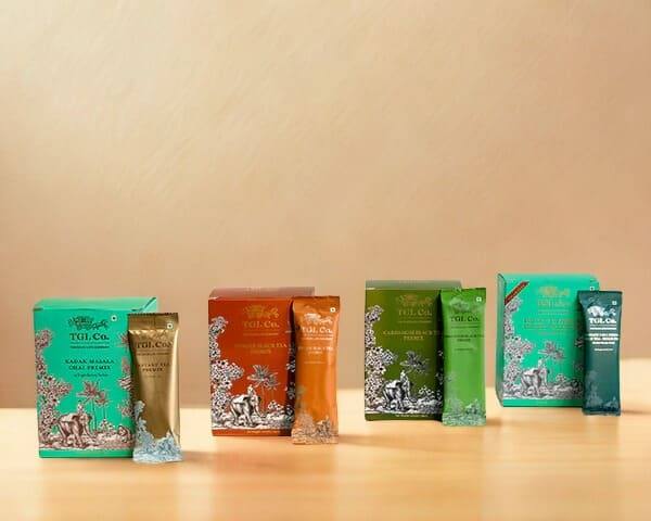 TGL Co. gourmet tea boxes and sachets in premium packaging, including herbal, spiced, and classic tea blends.