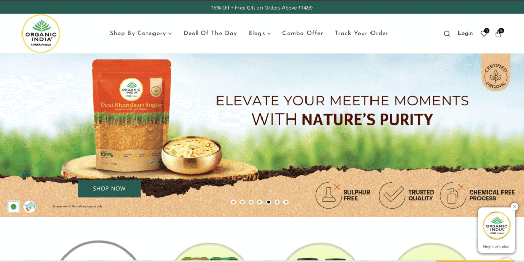 Organic India website banner featuring Desi Khandsari Sugar with tags highlighting sulphur-free, trusted quality, and chemical-free process, set against a green natural background.